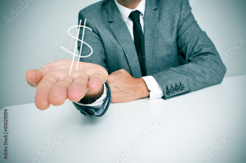 Photo: businessman and dollar sign businessman and dollar sign
