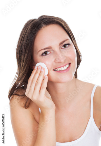 Photo: Woman Cleaning Face With Cotton Woman Cleaning Face With Cotton