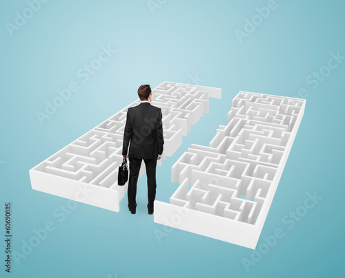 Photo: businessman looking at maze businessman looking at maze