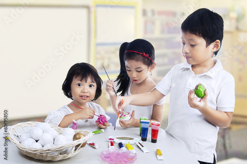 Photo: Children painting easter eggs Children painting easter eggs