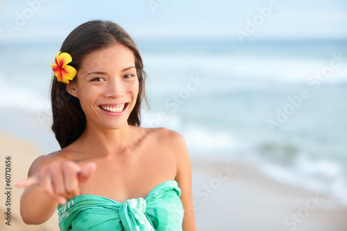 Photo: Hawaii beach smiling woman making shaka hand sign Hawaii beach smiling woman making shaka hand sign