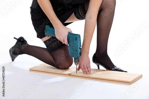 Photo: Woman provocatively using drill Woman provocatively using drill