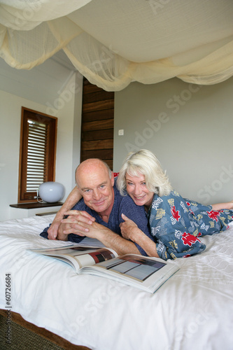 Photo: senior couple resting in bed senior couple resting in bed