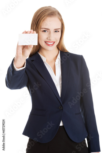 Photo: Beautiful caucasian business woman holding personal card. Beautiful caucasian business woman holding personal card.