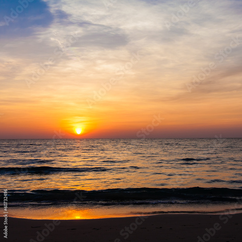 Photo: Sunset on the beach. sunrise in the sea Sunset on the beach. sunrise in the sea