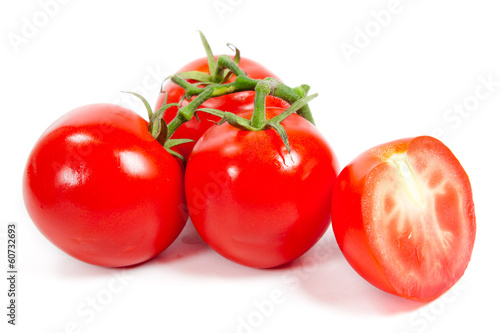 Photo: Fresh tomatoes isolated on white Fresh tomatoes isolated on white
