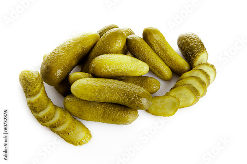 Photo: pickled cucumbers. Gherkins on a white background pickled cucumbers. Gherkins on a white background