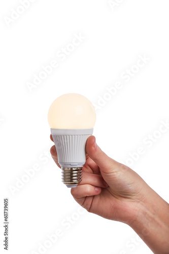 Photo: Hand holding bright led light bulb Hand holding bright led light bulb