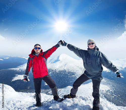 Photo: Climbers team on the snowy mountain. Sport concept Climbers team on the snowy mountain. Sport concept