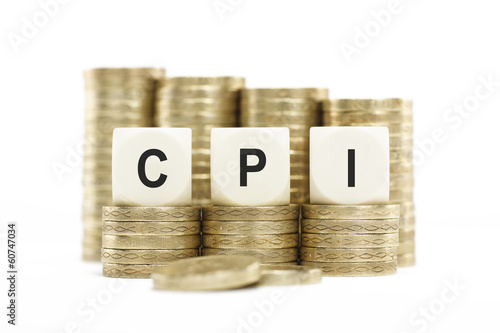 Photo: CPI (Consumer Price Index) on Coin Stacks Isolated White Backgro CPI (Consumer Price Index) on Coin Stacks Isolated White Backgro