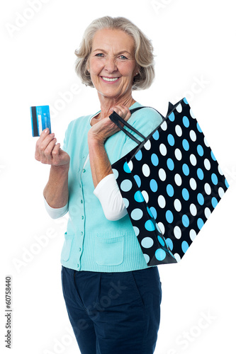 Photo: Aged woman displaying her cash card Aged woman displaying her cash card