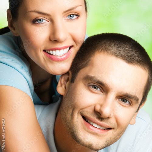 Photo: Portrait of happy couple, outdoors Portrait of happy couple, outdoors