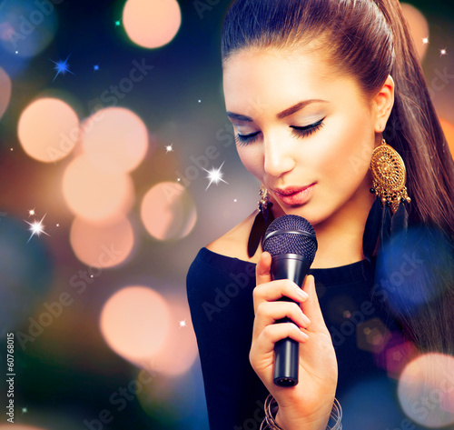 Photo: Beautiful Singing Girl. Beauty Woman with Microphone Beautiful Singing Girl. Beauty Woman with Microphone