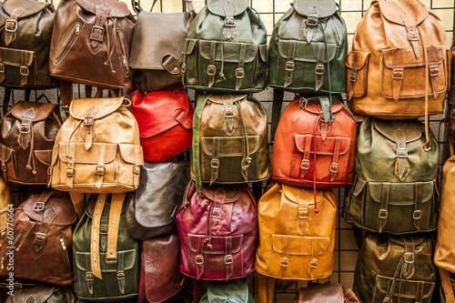 Photo: Leather backpacks background. Leather backpacks background.