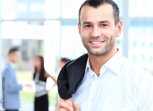 Photo: confident young businessman, smiling happy confident young businessman, smiling happy