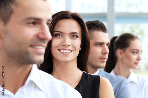 Photo: Successful happy woman with business group Successful happy woman with business group