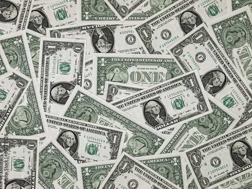 Photo: A Pile of One Dollar Bills as a Money Background A Pile of One Dollar Bills as a Money Background