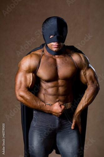 Photo: Strong muscular man in black mask Strong muscular man in black mask