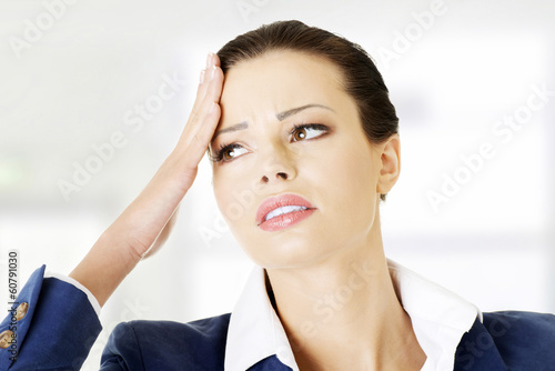 Photo: Beautiful businesswoman is having a headache. Beautiful businesswoman is having a headache.