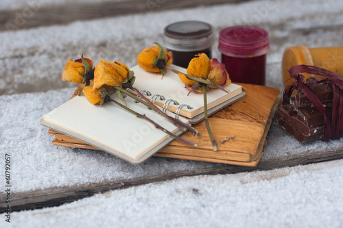 Photo: notebook, dry rose, paint and chocolate notebook, dry rose, paint and chocolate