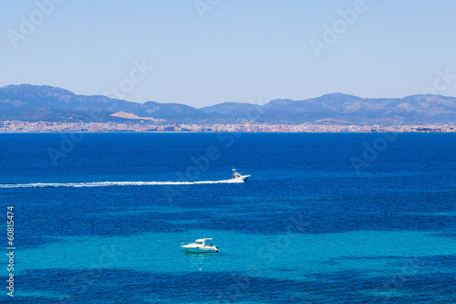 Photo: yachts in blue. Mallorca, Spain. Top view yachts in blue. Mallorca, Spain. Top view