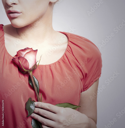 Photo: Girl and Flower.Red Rose on Red Dress.Tender Beauty.Lovely Gift Girl and Flower.Red Rose on Red Dress.Tender Beauty.Lovely Gift