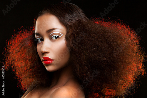 Photo: Lady with beautiful hairstyle and unusual makeup Lady with beautiful hairstyle and unusual makeup