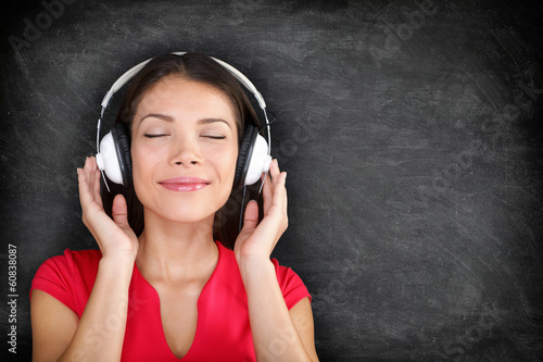 Photo: Music in headphones - Beautiful woman listening Music in headphones - Beautiful woman listening