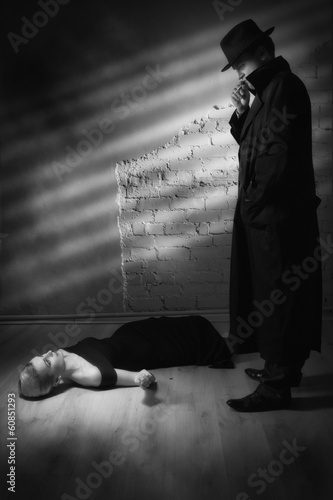 Photo: Detective investigating the crime scene Detective investigating the crime scene