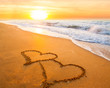 two hearts on beach sand two hearts on beach sand