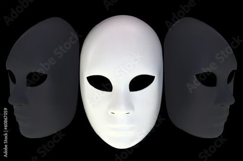 Photo: White mask with reflection on black background White mask with reflection on black background