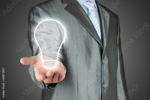 Photo: Man pushes icon on dark background Man pushes icon on dark background