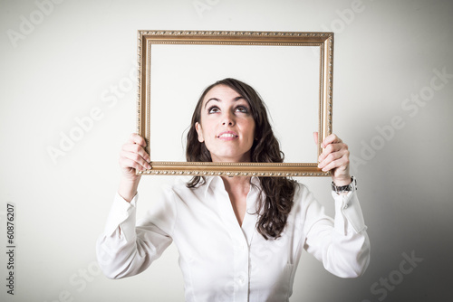 Photo: beautiful young businesswoman through ledge beautiful young businesswoman through ledge