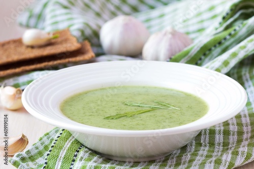Photo: Green garlic cream soup, leaves rukola, arugula, healthy diet Green garlic cream soup, leaves rukola, arugula, healthy diet