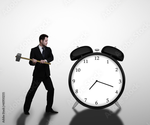 Photo: businessman breaks clock businessman breaks clock