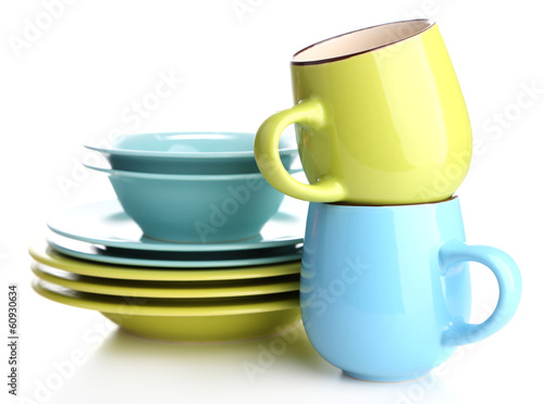 Photo: Clean colorful tableware isolated on white Clean colorful tableware isolated on white