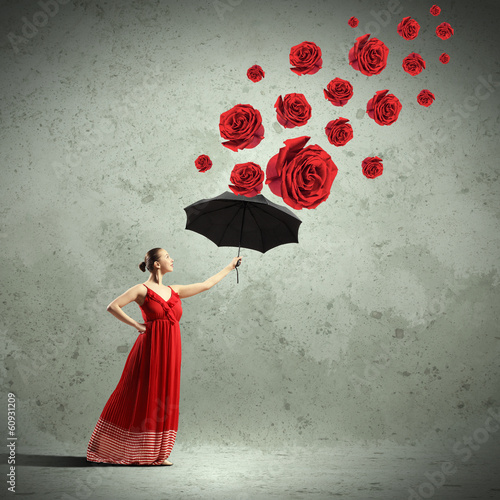Photo: Ballet dancer in flying satin dress with umbrella Ballet dancer in flying satin dress with umbrella