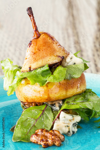 Photo: Original way to serve pear salad with green leafs, blue cheese a Original way to serve pear salad with green leafs, blue cheese a