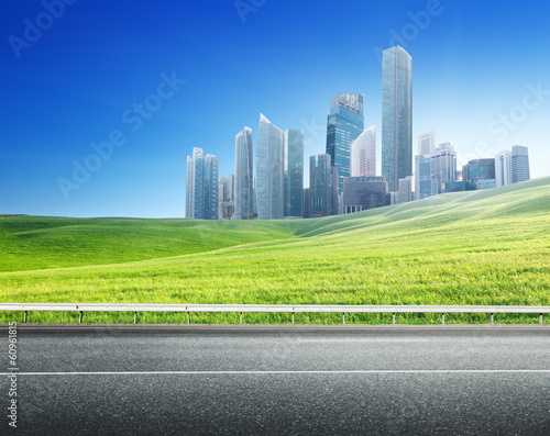 Photo: Asphalt road and modern city Asphalt road and modern city
