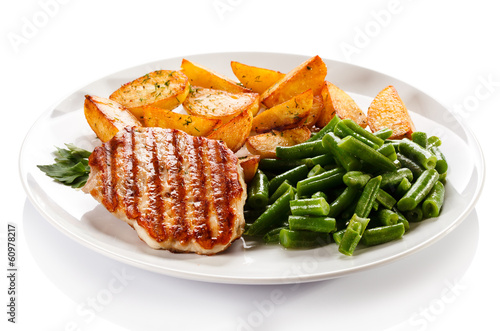 Photo: Grilled steak, baked potatoes and vegetables Grilled steak, baked potatoes and vegetables