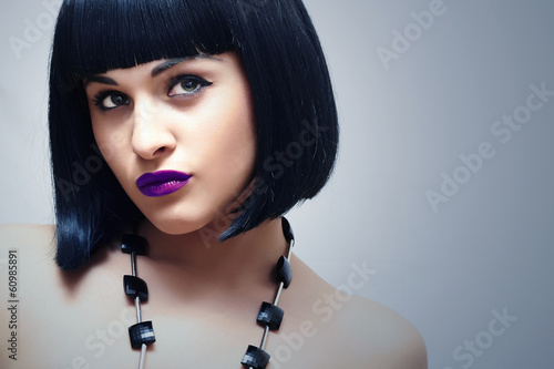 Photo: Retro Beautiful Brunette Woman.Bob Haircut.Dark Blue lips.Beauty Retro Beautiful Brunette Woman.Bob Haircut.Dark Blue lips.Beauty