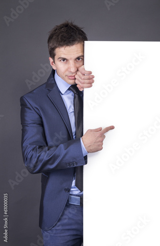 Photo: Businessman holding blank table for text Businessman holding blank table for text