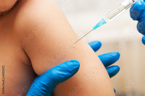 Photo: Boy and vaccine syringe Boy and vaccine syringe