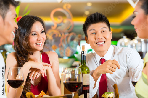 Photo: Chinese business people dining in elegant restaurant Chinese business people dining in elegant restaurant