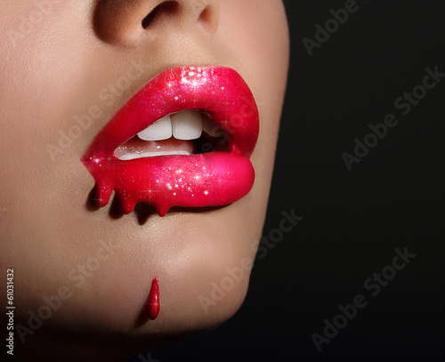 Photo: Art. Sensual Smeared Woman's Red Lips with Sparkles Art. Sensual Smeared Woman's Red Lips with Sparkles