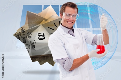 Photo: Composite image of young scientist working with a beaker Composite image of young scientist working with a beaker