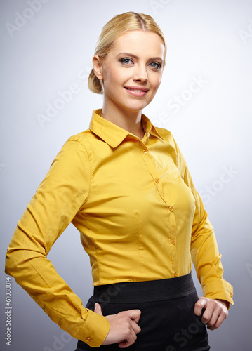 Photo: Portrait of smiling business woman, isolated on grey background Portrait of smiling business woman, isolated on grey background