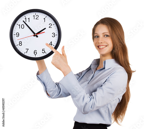 Photo: Girl shows on the round clock Girl shows on the round clock
