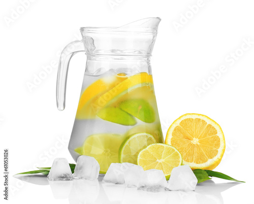 Photo: Cold water with lime, lemon and ice in pitcher isolated on Cold water with lime, lemon and ice in pitcher isolated on