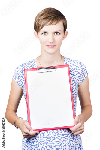 Photo: Young woman displaying a blank clipboard Young woman displaying a blank clipboard